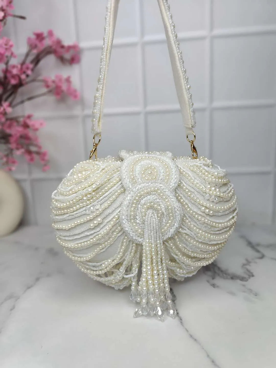 Ishhaara White Embroidery Tassel Oval Beauty Clutches