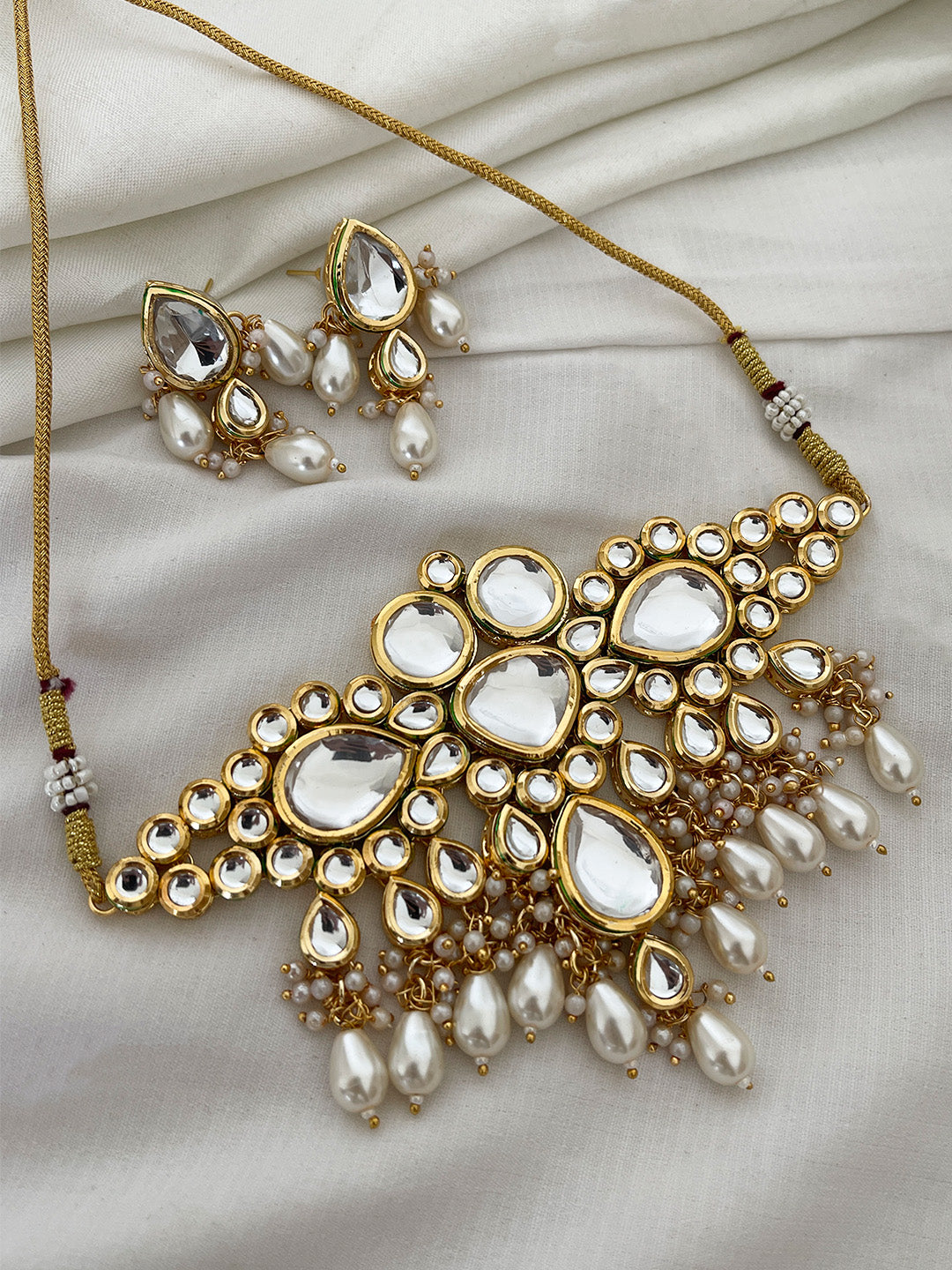 Ishhaara White Kundan Studded And Beaded Jewellery Set