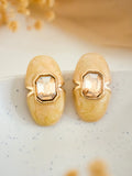 Ishhaara Yellow Carved Natural Coral Oval Earrings